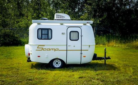 The 5th wheel offers the side bathroom option, as well as rooftop AC. . Scamp travel trailers